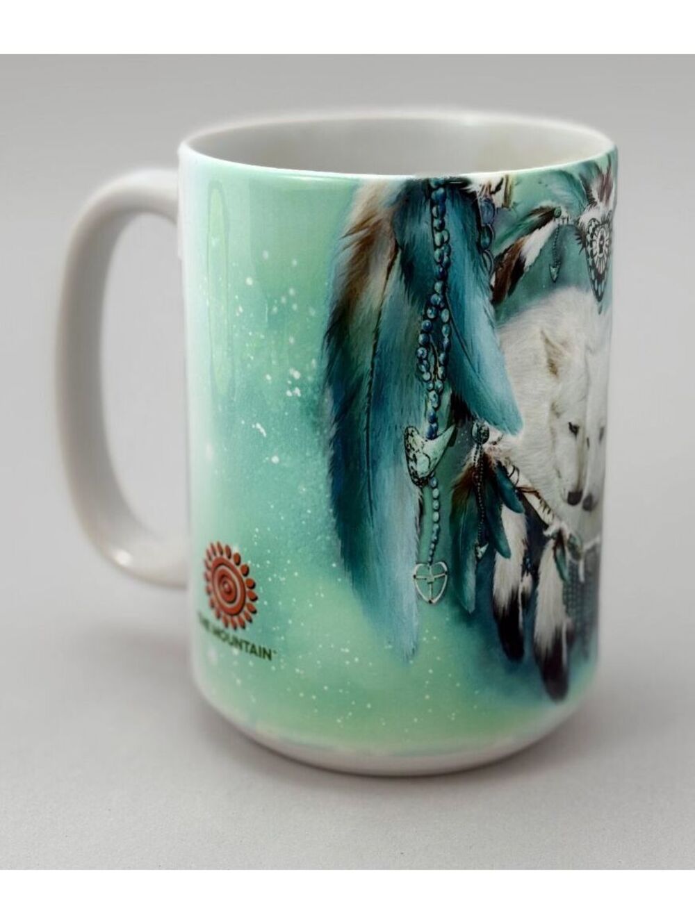 Blue Mountain Ceramic Mug with White Wolf and Feather Design